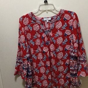 PxL.    Made in India.    The red, the is blue , on trim is navy